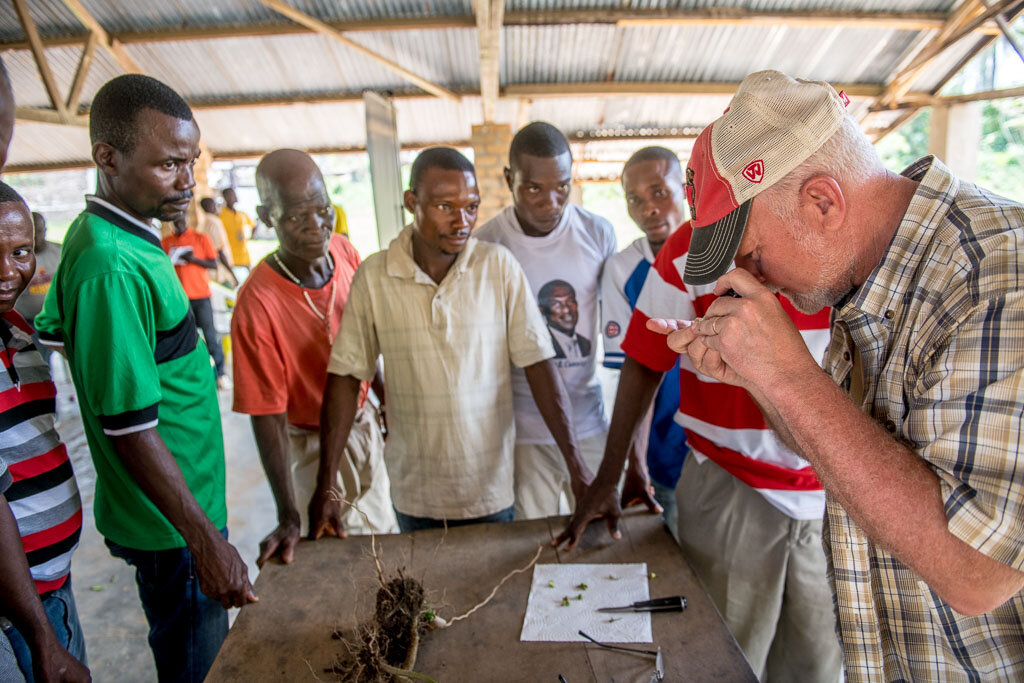 Students learning about agriculture around a table